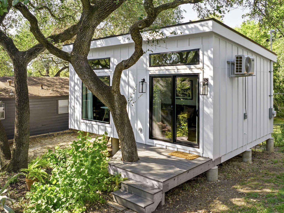 RedOven Builds custom home exterior detail with black framed glass doors Austin TX 3102 S Oak Dr