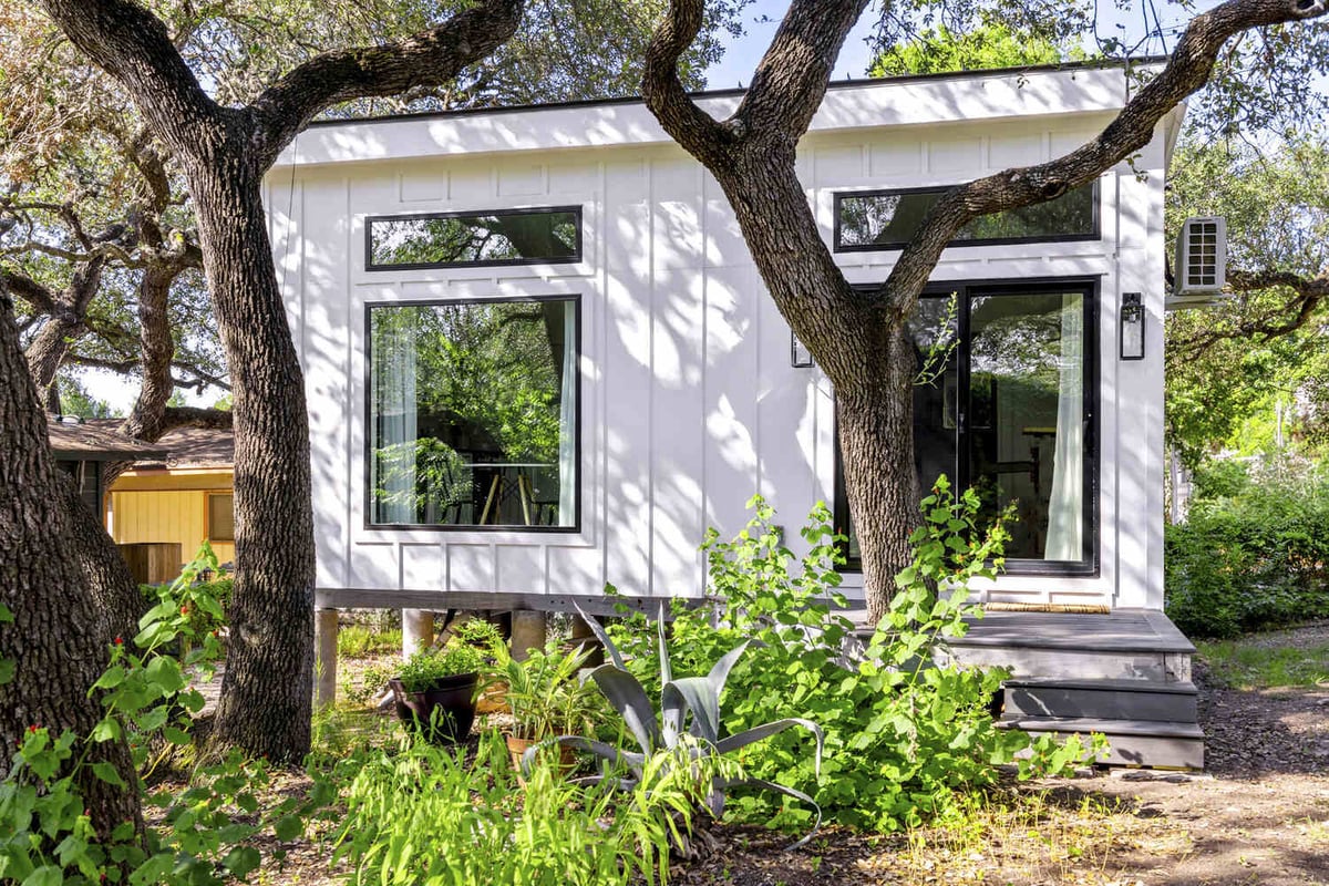 RedOven Builds custom home exterior showcasing nature-integrated design Austin TX 3102 S Oak Dr