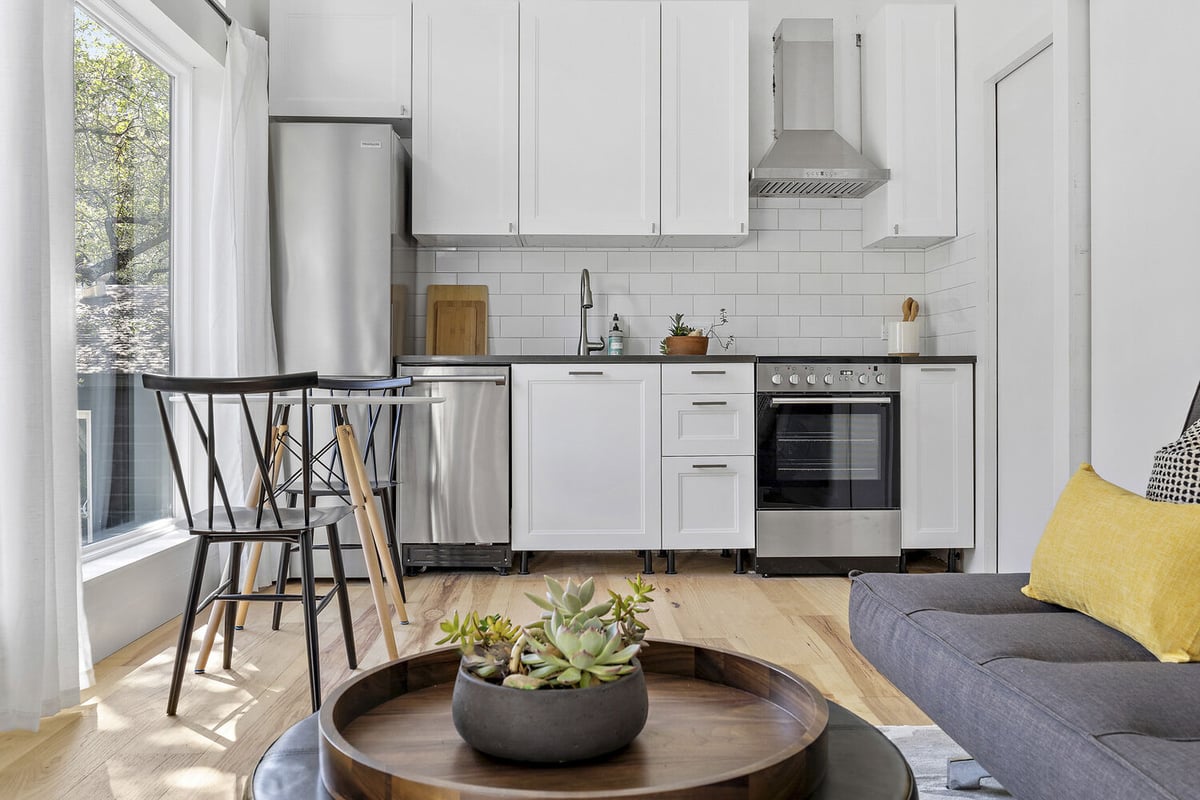 RedOven Builds custom home kitchen and living room with modern finishes Austin TX 3102 S Oak Dr