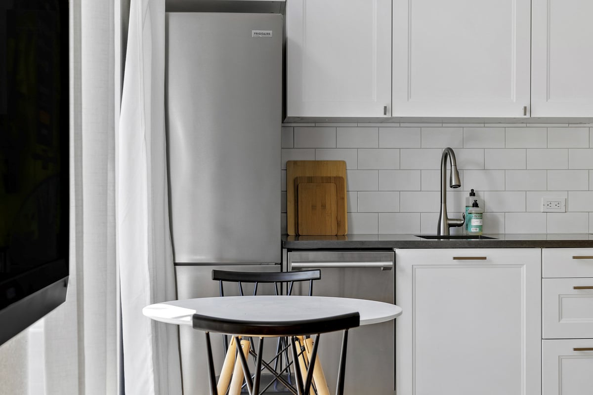 RedOven Builds custom home kitchen with compact dining space and modern finishes Austin TX 3102 S Oak Dr