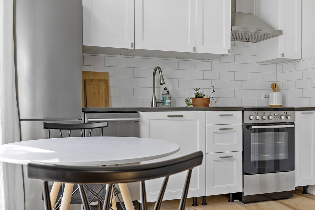 RedOven Builds custom home kitchen with quartz countertops and modern cabinetry Austin TX 3102 S Oak Dr