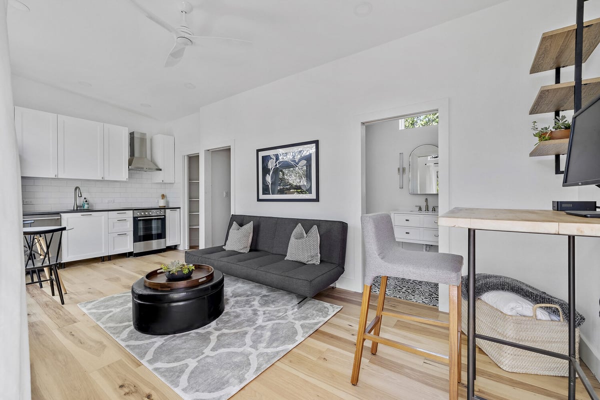 RedOven Builds custom home open concept living room and kitchen with modern finishes Austin TX 3102 S Oak Dr