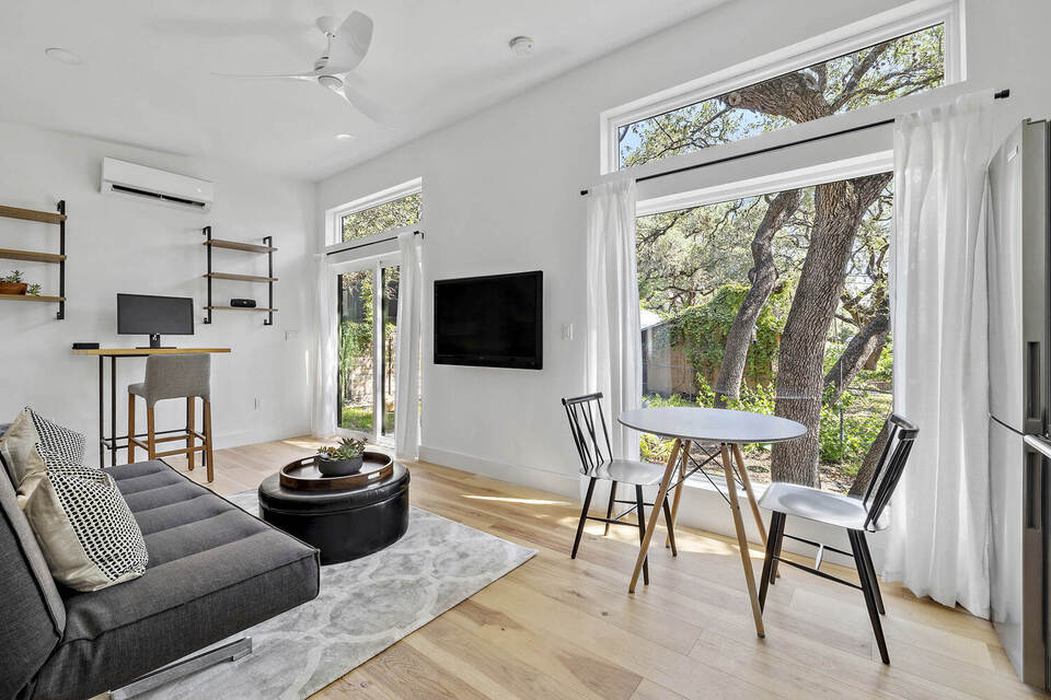 RedOven Builds modern custom home interior with bright living space and kitchen Austin TX 3102 S Oak Dr