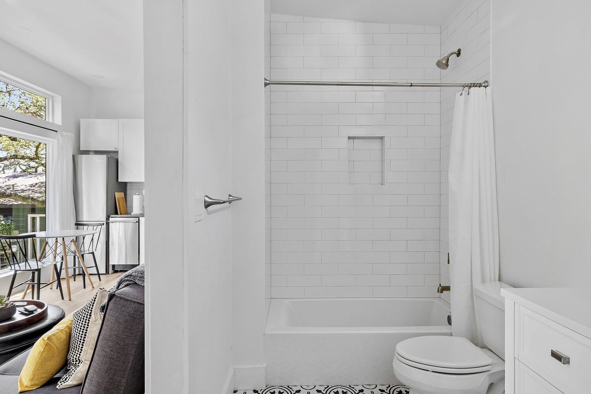 open concept ADU interior by RedOven Builds in 3102 S Oak Dr TX with bathroom and living space connection