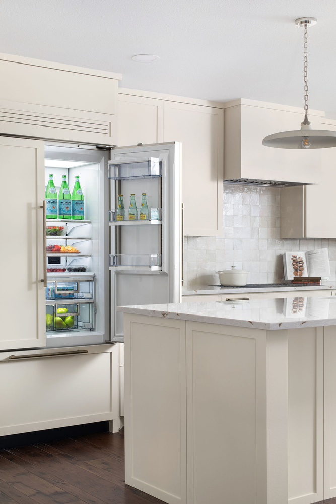 built-in refrigerator with organized interior in kitchen remodel by RedOven Builds in Whitemarsh Austin TX