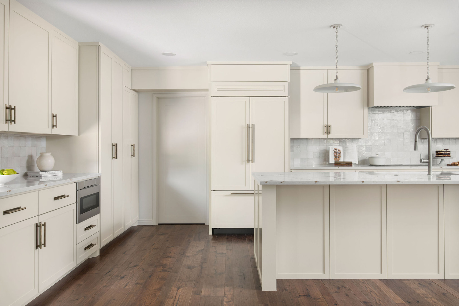wide view of kitchen remodel by RedOven Builds in Whitemarsh Austin TX with island and hardwood floors