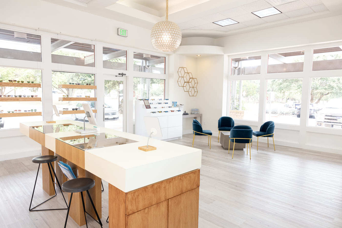 Open eye center layout with display tables, seating, and natural light in Austin, TX by RedOven Builds
