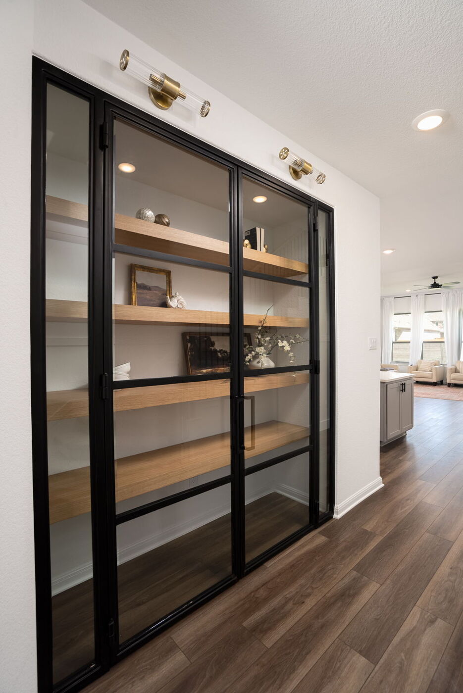 Glass-front built-in shelving with wood shelves in Austin, TX remodel by RedOven Builds