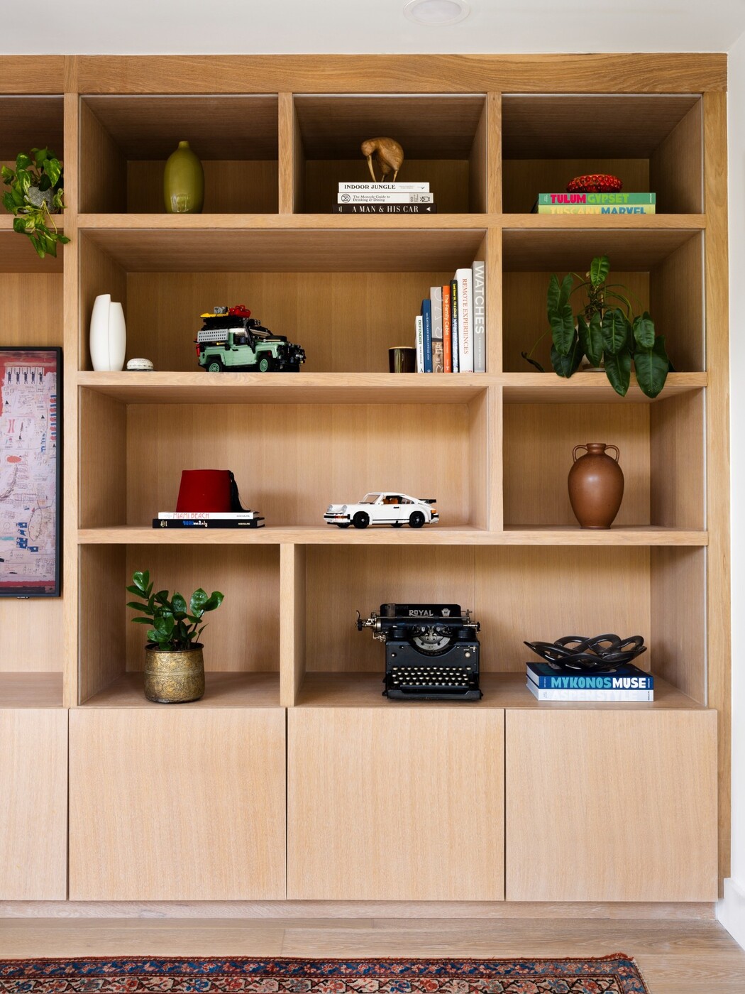 kitchenette-with-white-oak-cabinets-black-countertop-and-compact-layout-in-austin-texas-by-redoven-builds
