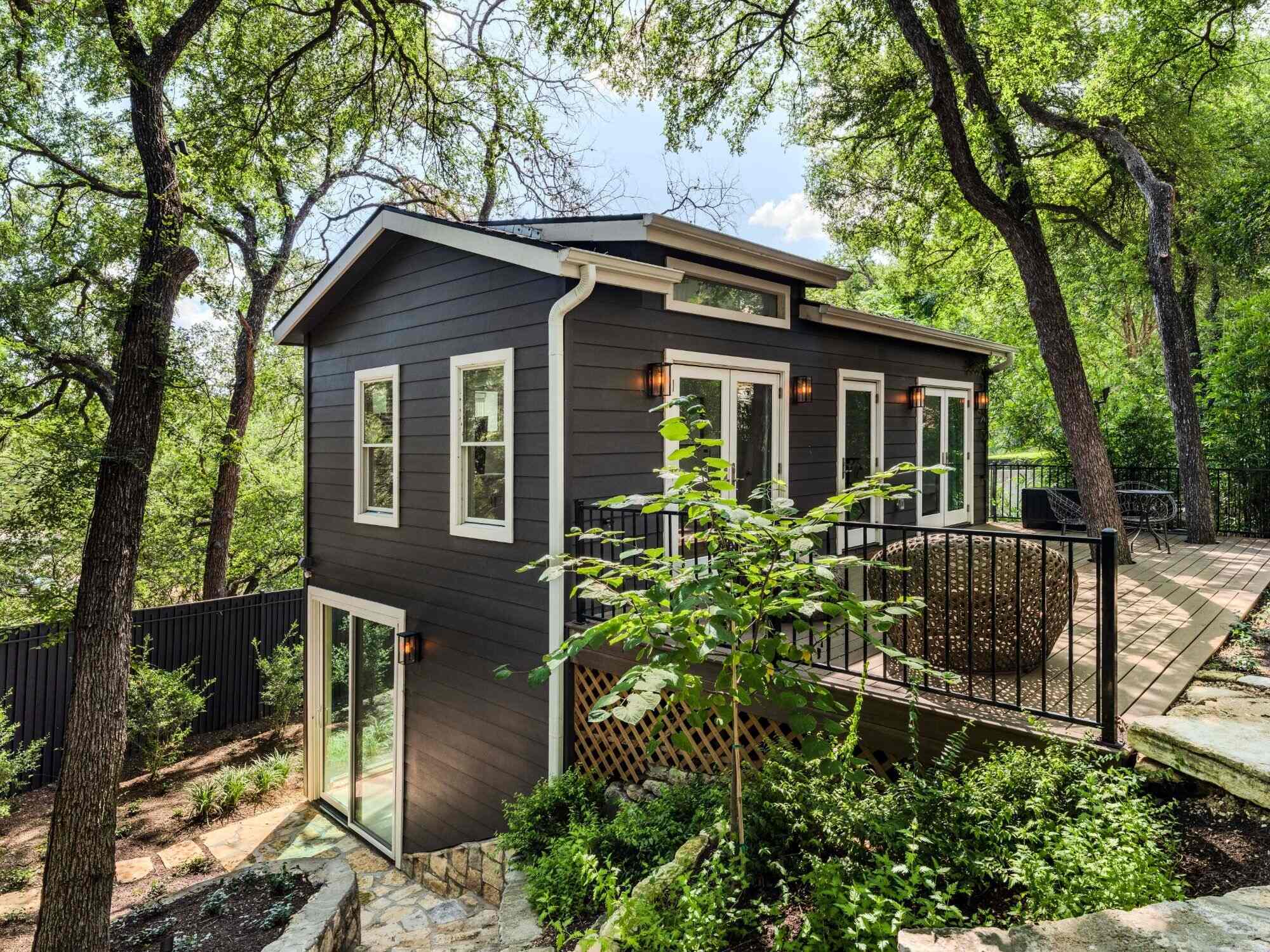 outdoor-deck-space-with-mature-trees-and-modern-home-exterior-in-austin-texas-by-redoven-builds