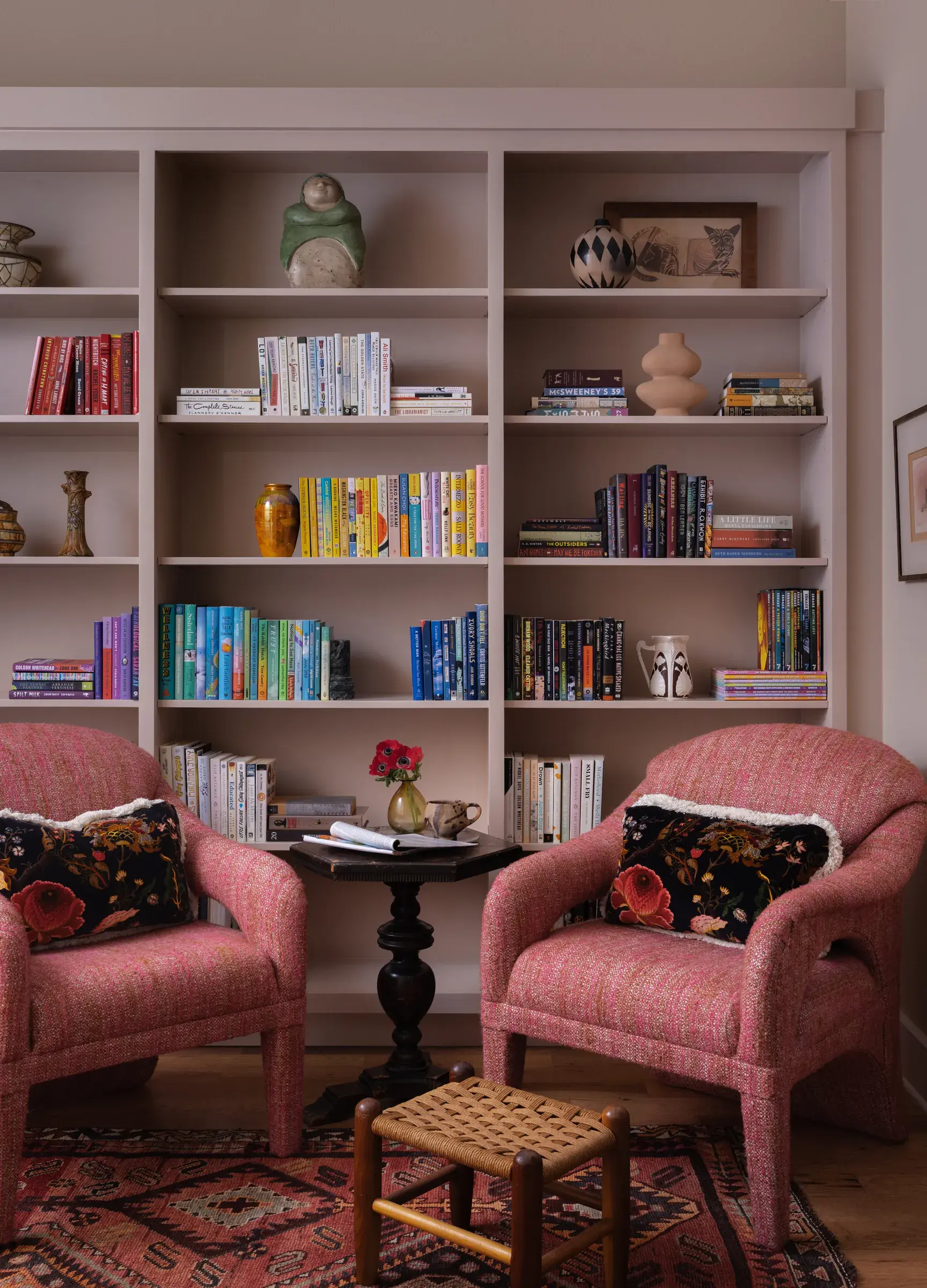 scenic-overlook-library-built-in-bookshelves-pink-armchairs
