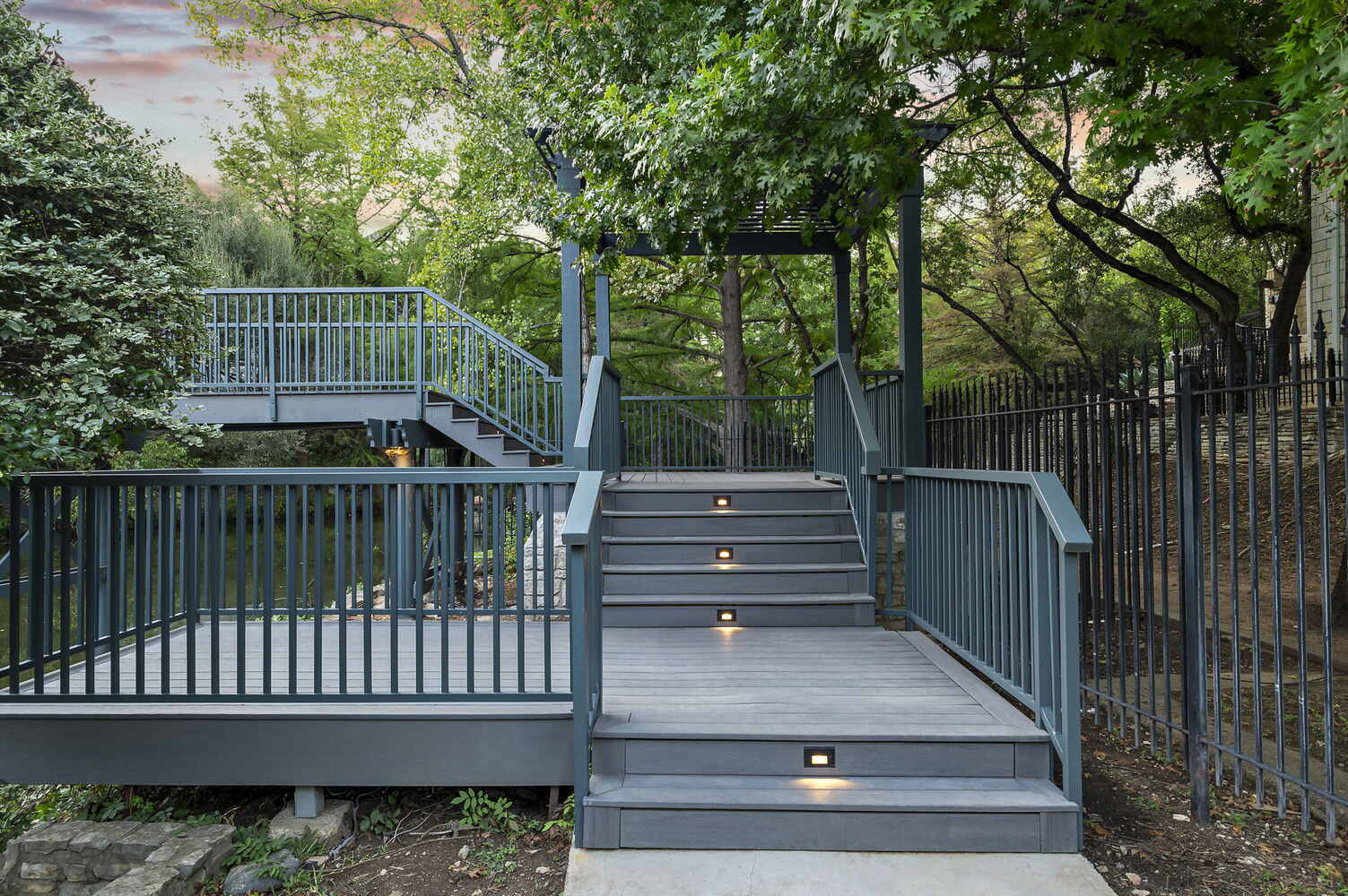 RedOven Builds commercial remodel deck stairs with integrated lighting at 4408 Long Champ Dr Austin, TX