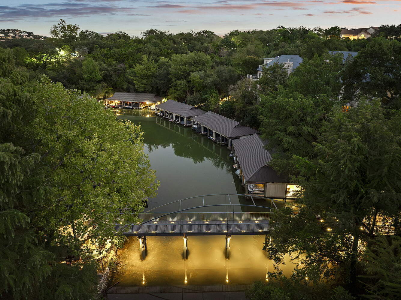 aerial perspective of lakeside docks and custom bridge from RedOven Builds commercial remodel Austin TX