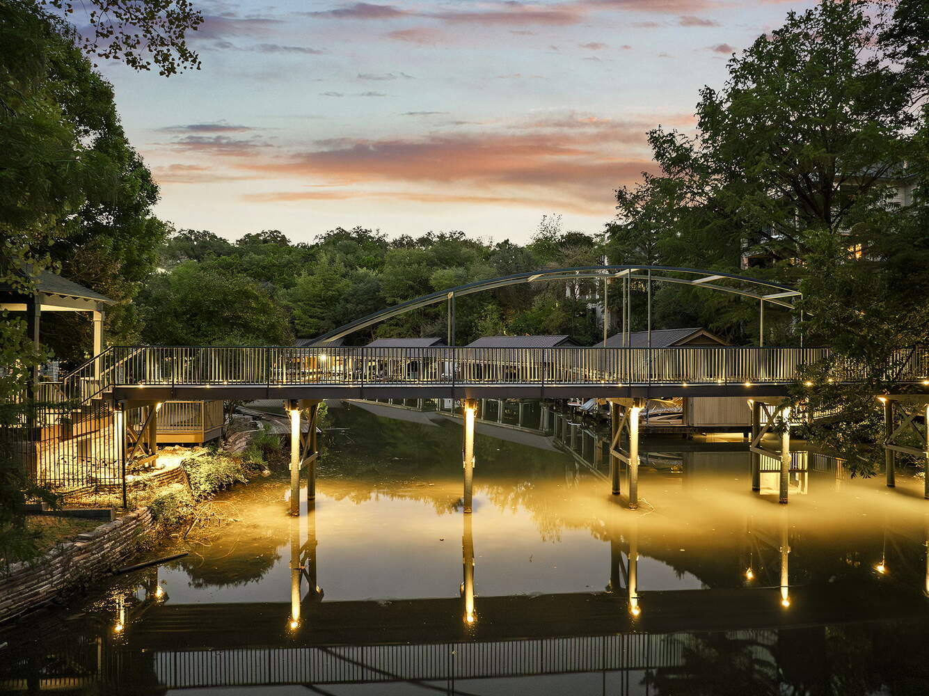 evening shot of custom metal bridge from RedOven Builds commercial remodel Austin TX