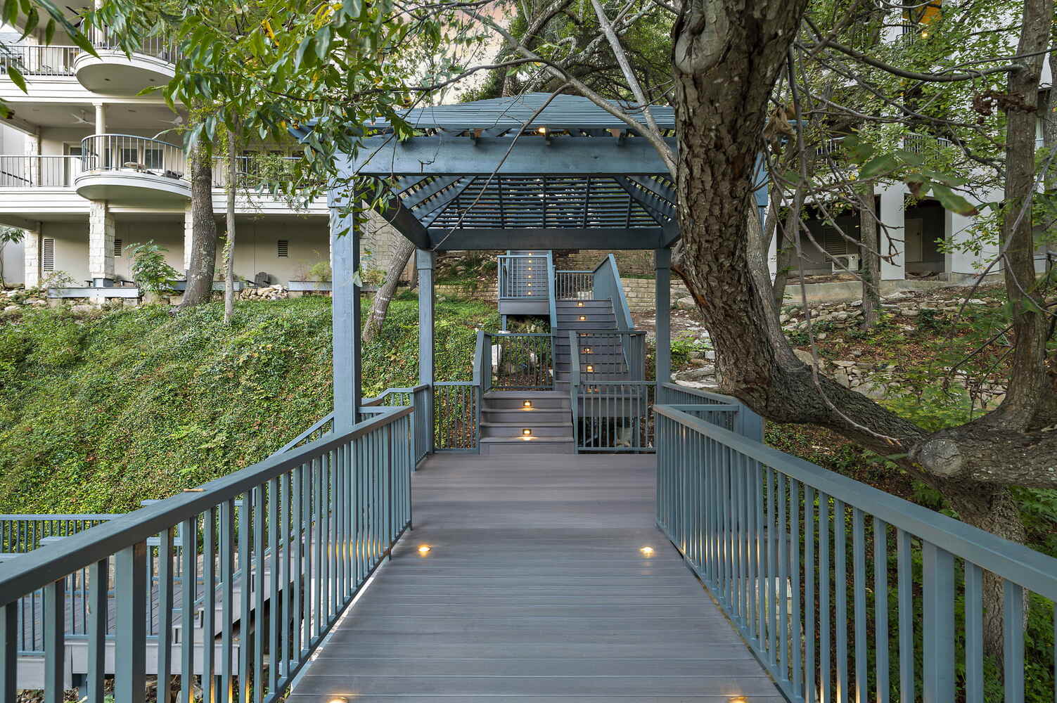 outdoor pergola style landing and stair system by RedOven Builds in Austin, TX