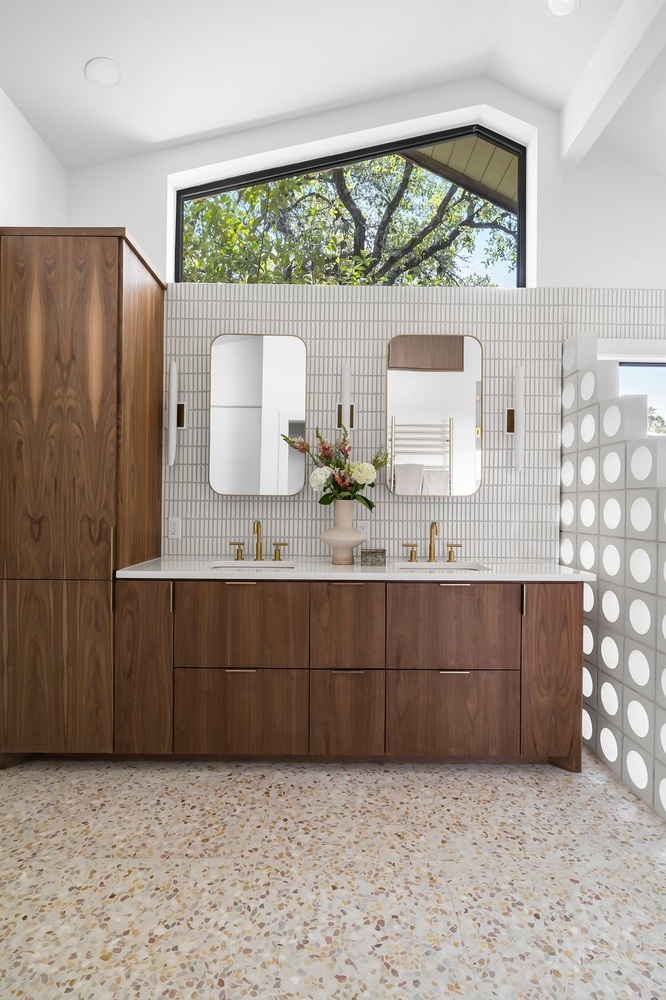 RedOven Builds Austin TX bathroom remodel with double vanity and large window bringing in natural light