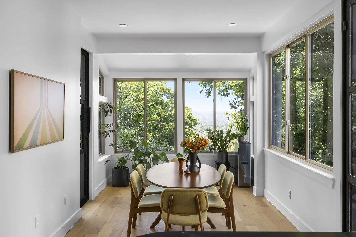 bright dining room with scenic hill views and modern finishes in Austin TX full home remodel by RedOven Builds