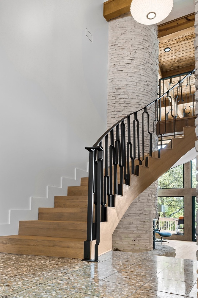 interior stair remodel with natural wood and stone accents in Austin TX by RedOven Builds