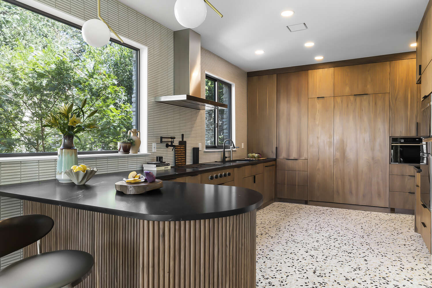 luxury kitchen remodel with wood finishes and modern appliances in Austin Texas by RedOven Builds