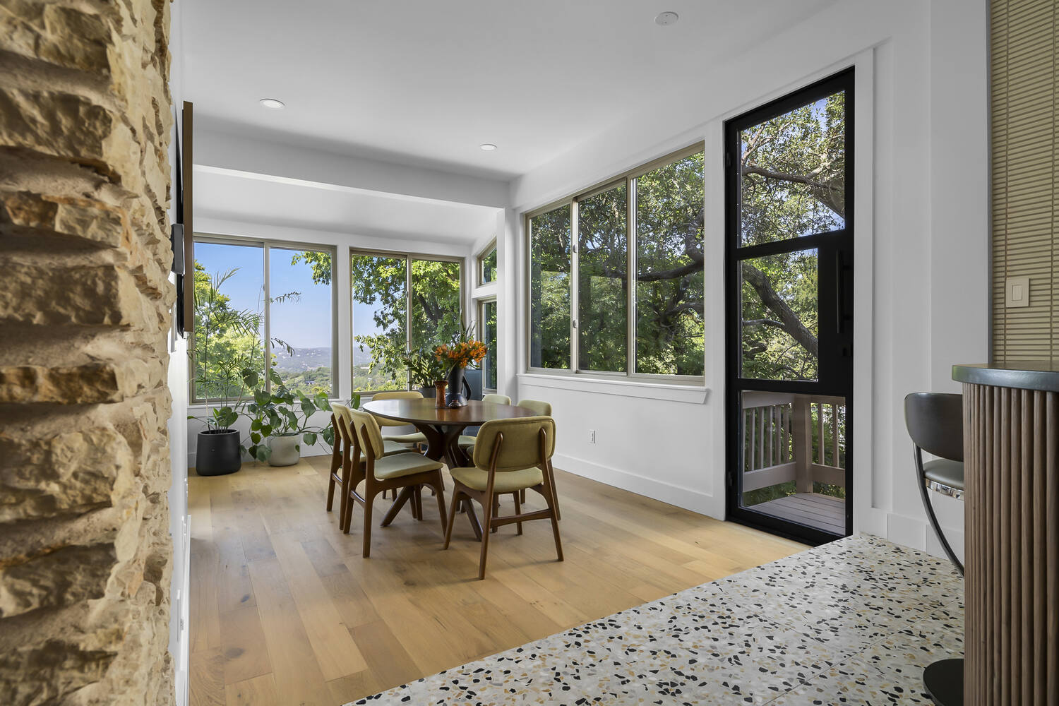open dining and kitchen area with terrazzo flooring in Austin TX full home remodel by RedOven Builds
