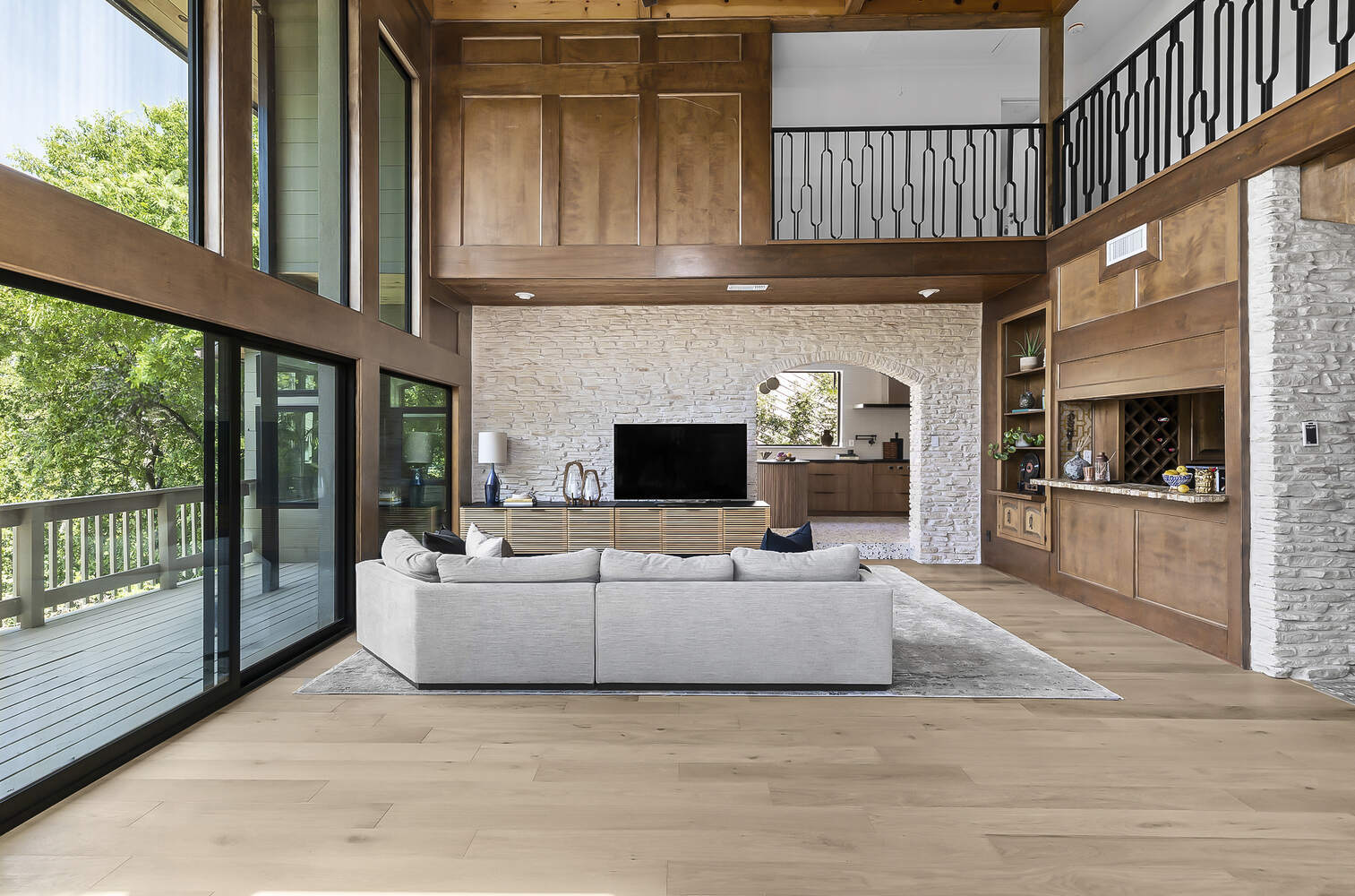 open living room with wood accents and large windows in Austin TX remodel by RedOven Builds