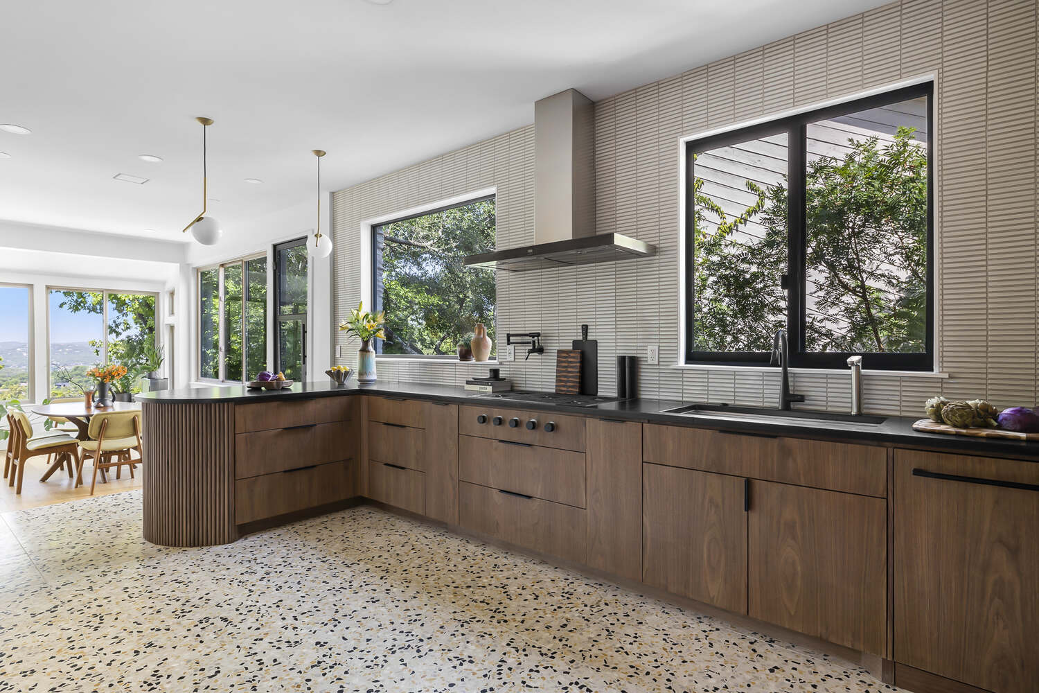 remodeled kitchen featuring sleek cabinetry and window lighting by RedOven Builds Austin TX