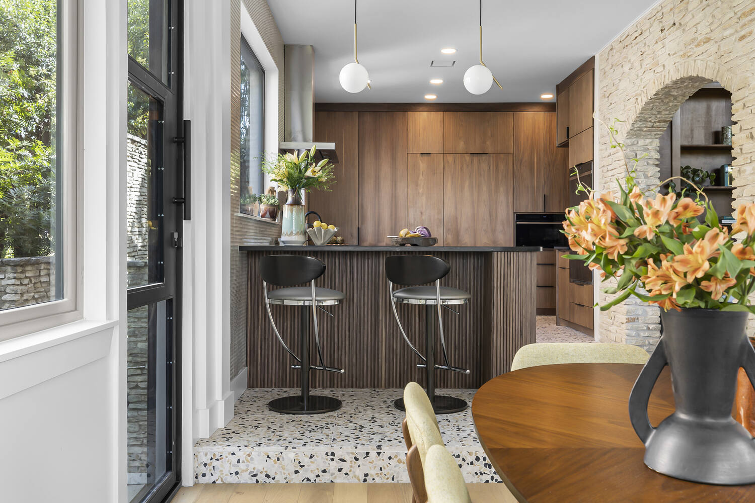 remodeled kitchen with island and scenic window views in Austin TX by RedOven Builds
