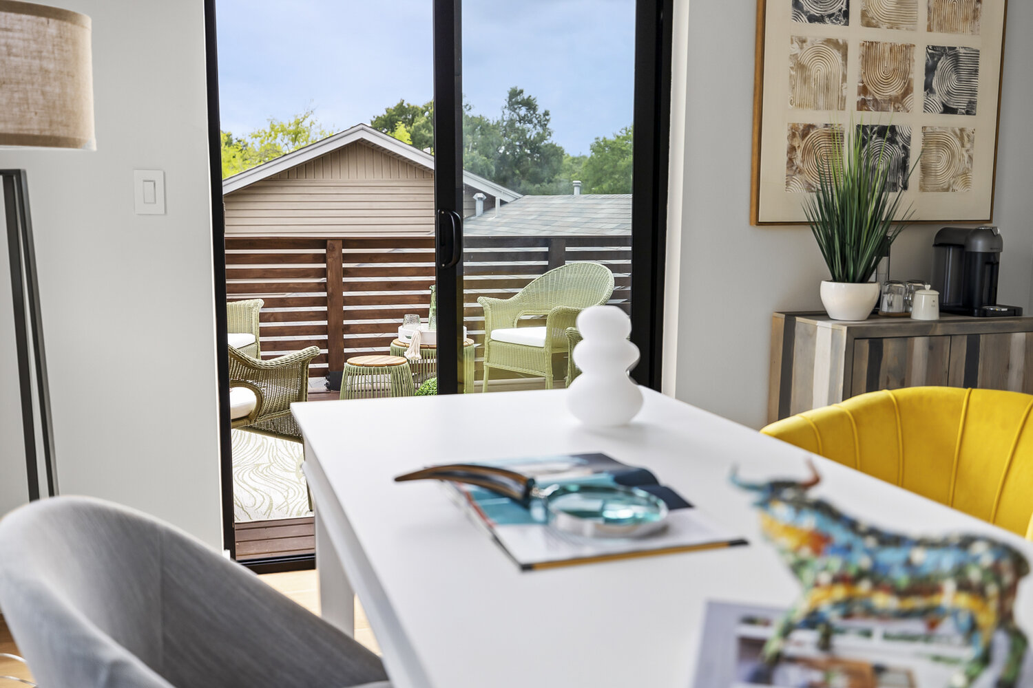 ADU office view toward deck with modern decor and seating by RedOven Builds in Austin TX