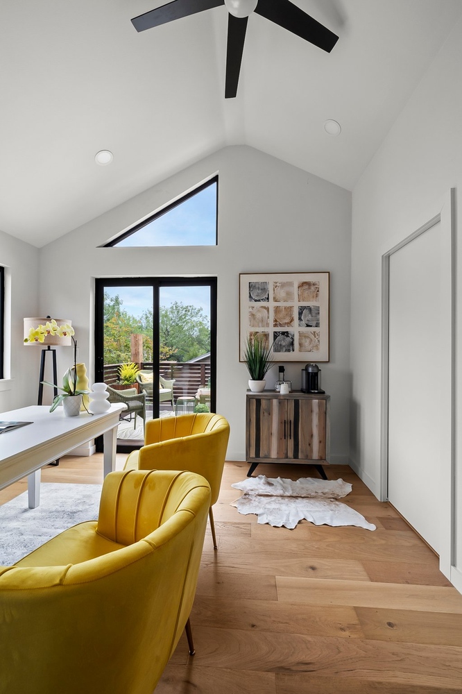 ADU office with sliding glass doors opening to deck by RedOven Builds in Austin TX