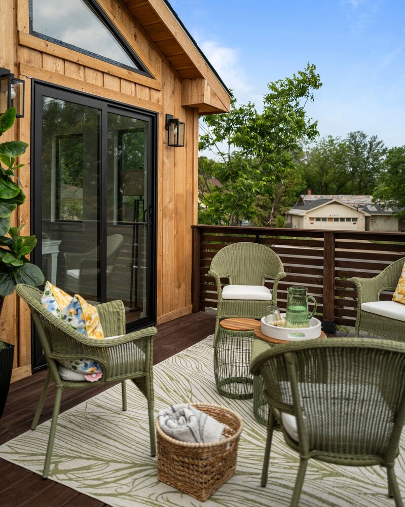 RedOven Builds ADU balcony with sliding glass door and modern outdoor seating in Austin, TX