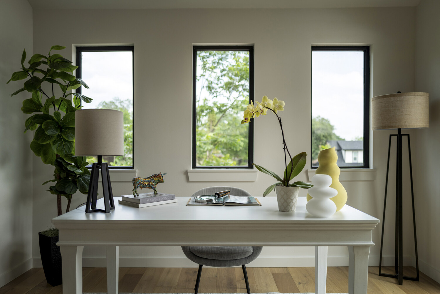 RedOven Builds ADU interior office desk with decor and three windows in Austin, TX