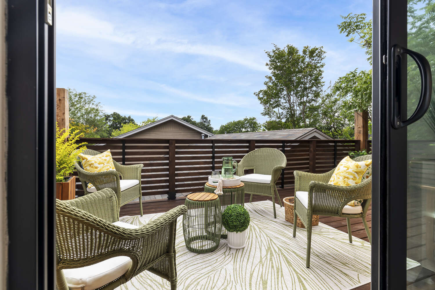 bright ADU interior with modern desk and outdoor patio view by RedOven Builds Austin TX