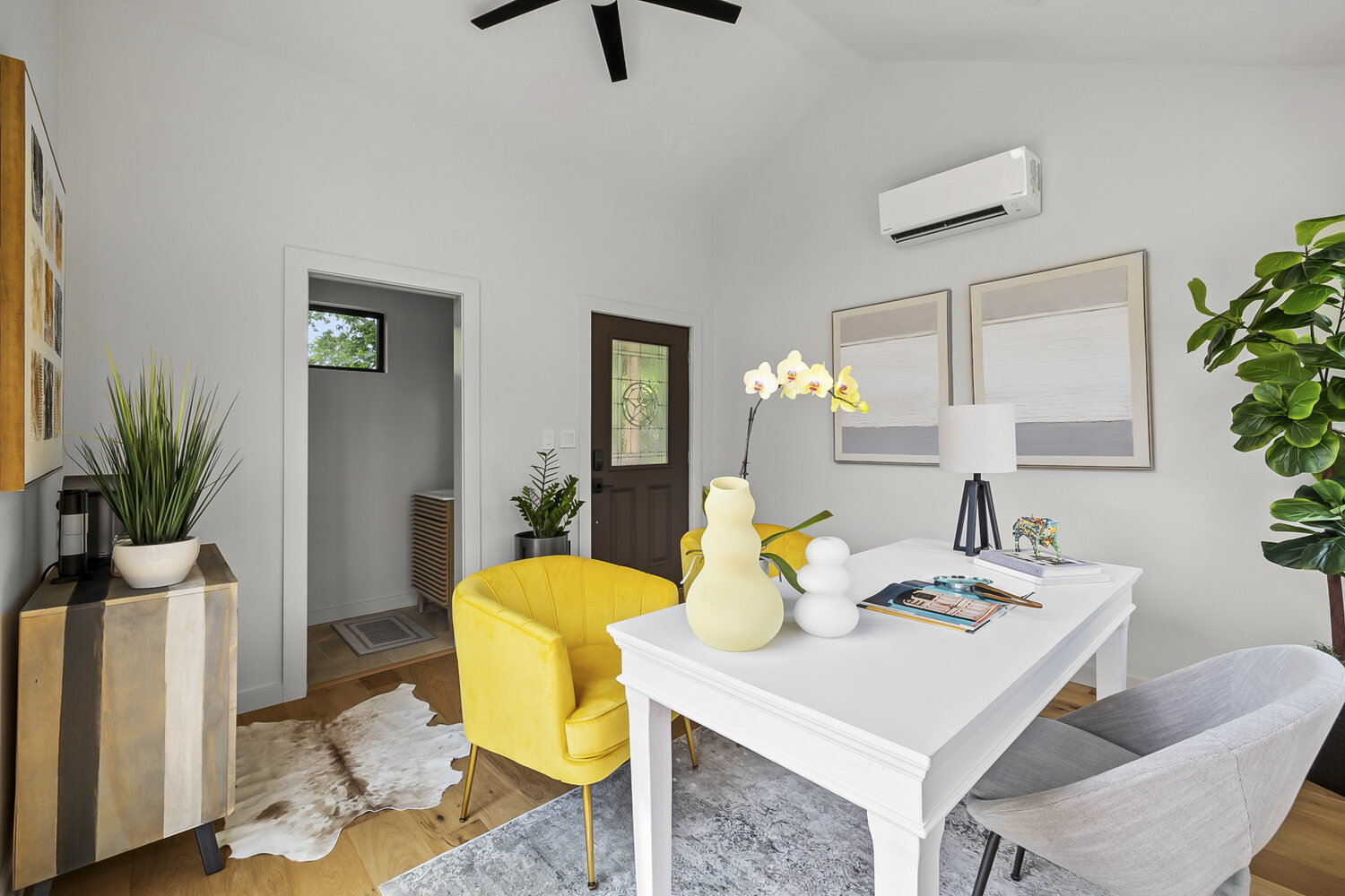 contemporary ADU interior featuring desk area and vibrant seating by RedOven Builds Austin TX