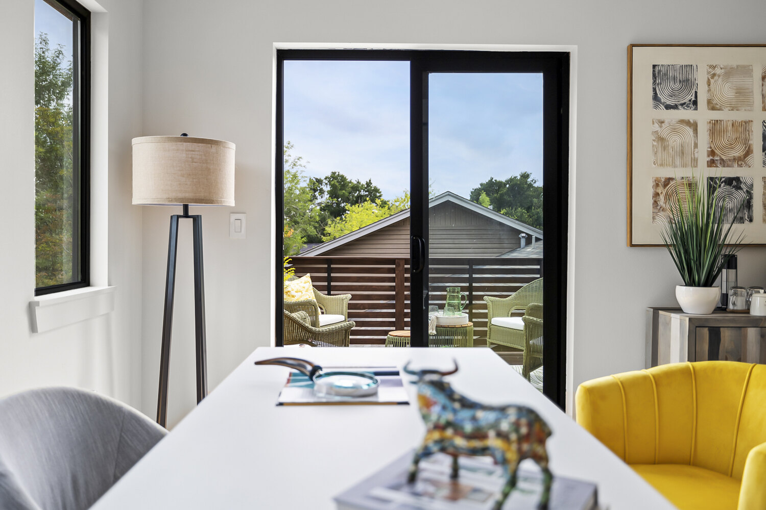 detailed ADU workspace with decor accents and patio view by RedOven Builds Austin TX