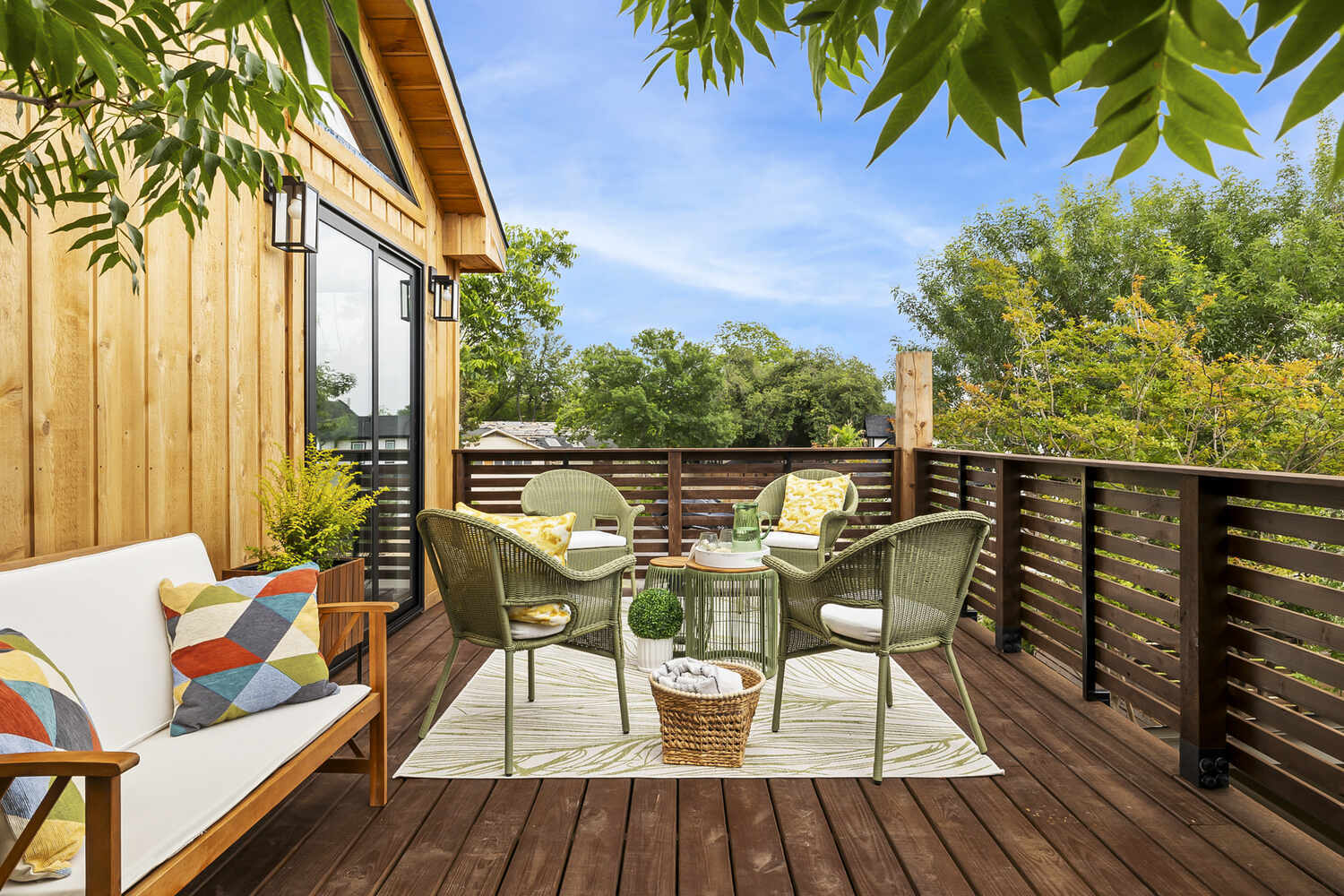 spacious ADU deck with outdoor seating and wood siding exterior by RedOven Builds in Austin TX
