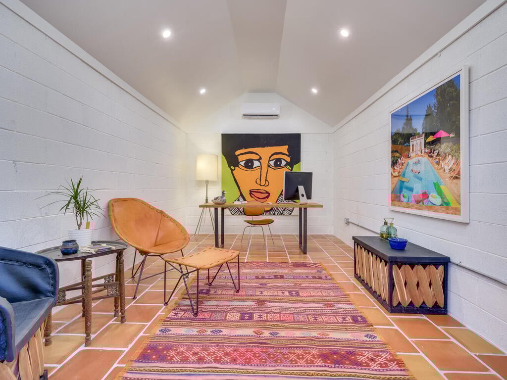 Contemporary backyard office space with desk and seating by RedOven Builds in Austin, TX