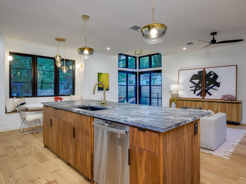 Custom new build kitchen with island seating and contemporary finishes by RedOven Builds in Austin, TX
