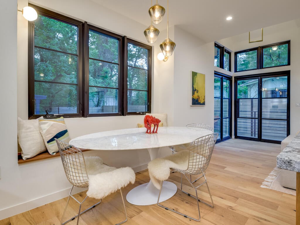 Modern breakfast nook with built-in seating by RedOven Builds in Austin, TX