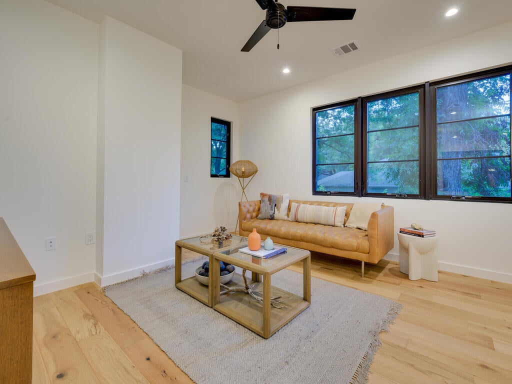 Modern living nook with natural light and stylish decor by RedOven Builds in Austin, TX