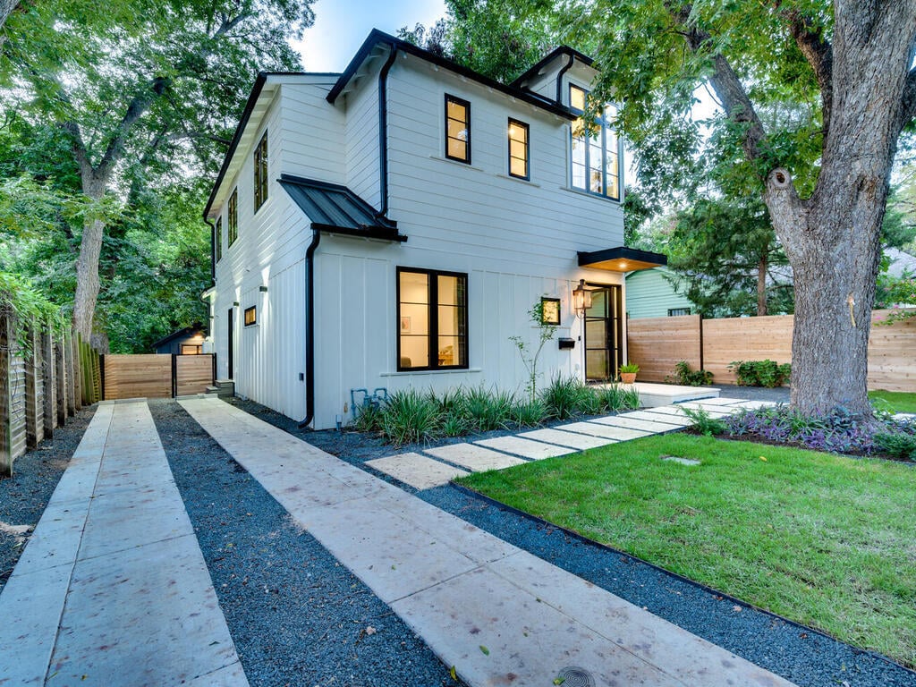 RedOven Builds new build exterior with modern siding, driveway, and landscaping in Austin, TX