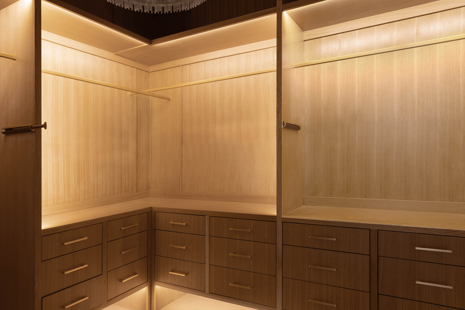 RedOven Builds custom walk-in closet with wood cabinetry and built-in drawers in Austin, TX