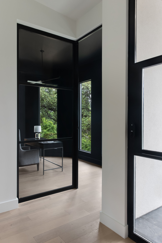 RedOven Builds modern glass office with black framed doors and large windows in Austin, TX