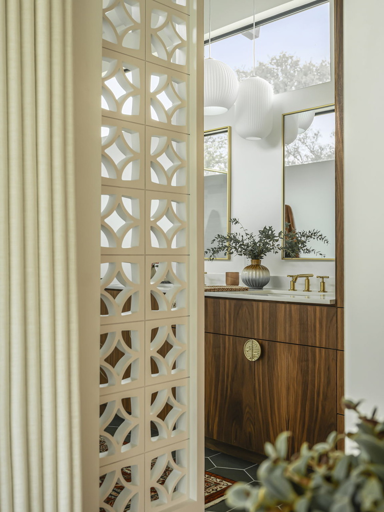 close-up of stylish bathroom vanity and partition design by RedOven Builds in Rio Grande TX