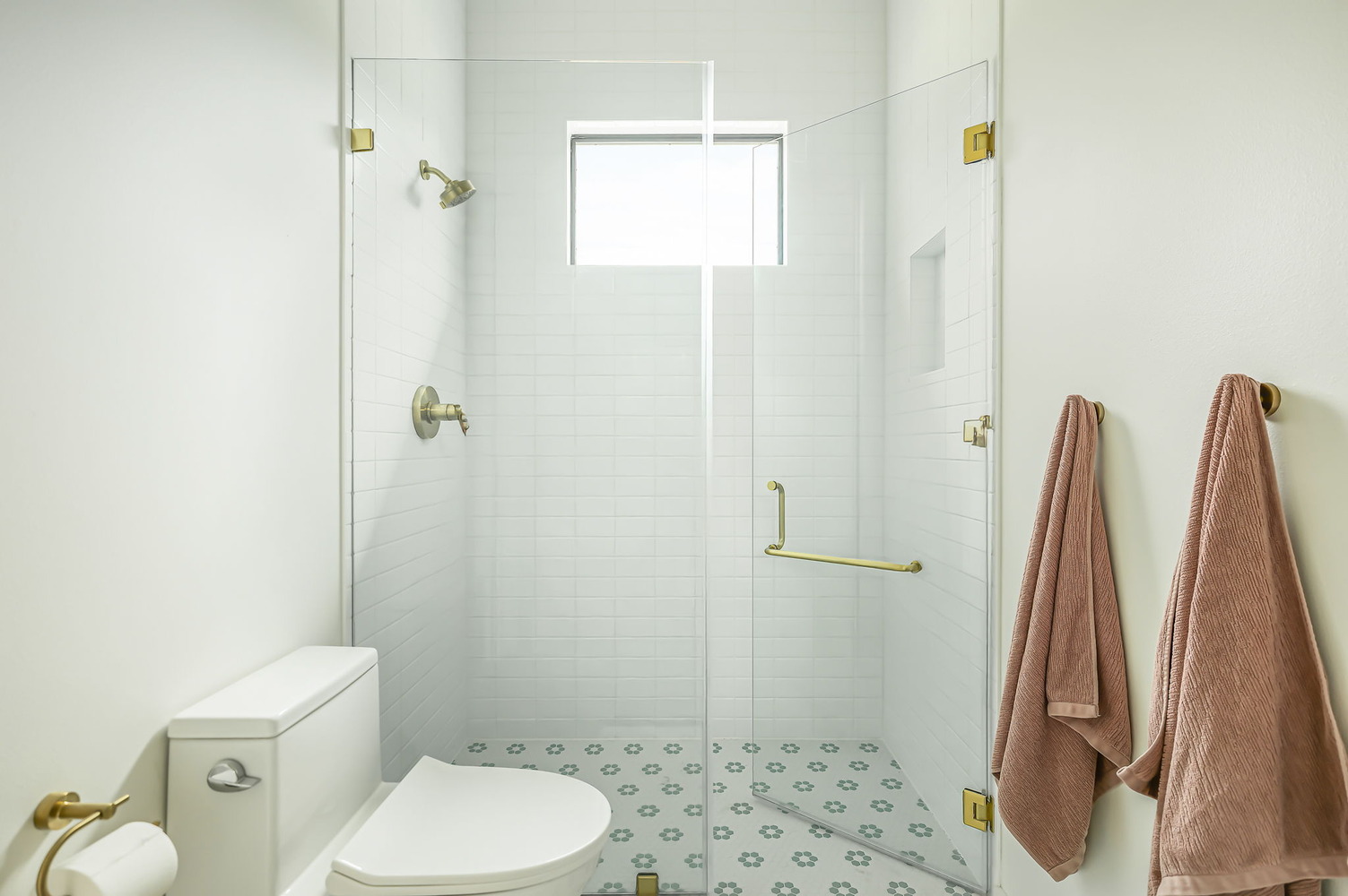 contemporary bathroom by RedOven Builds featuring walk-in shower and decorative tile in San Juan Dr Rio Grande TX