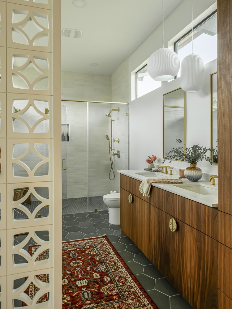 custom bathroom featuring hex tile flooring and walnut cabinetry in Rio Grande TX by RedOven Builds