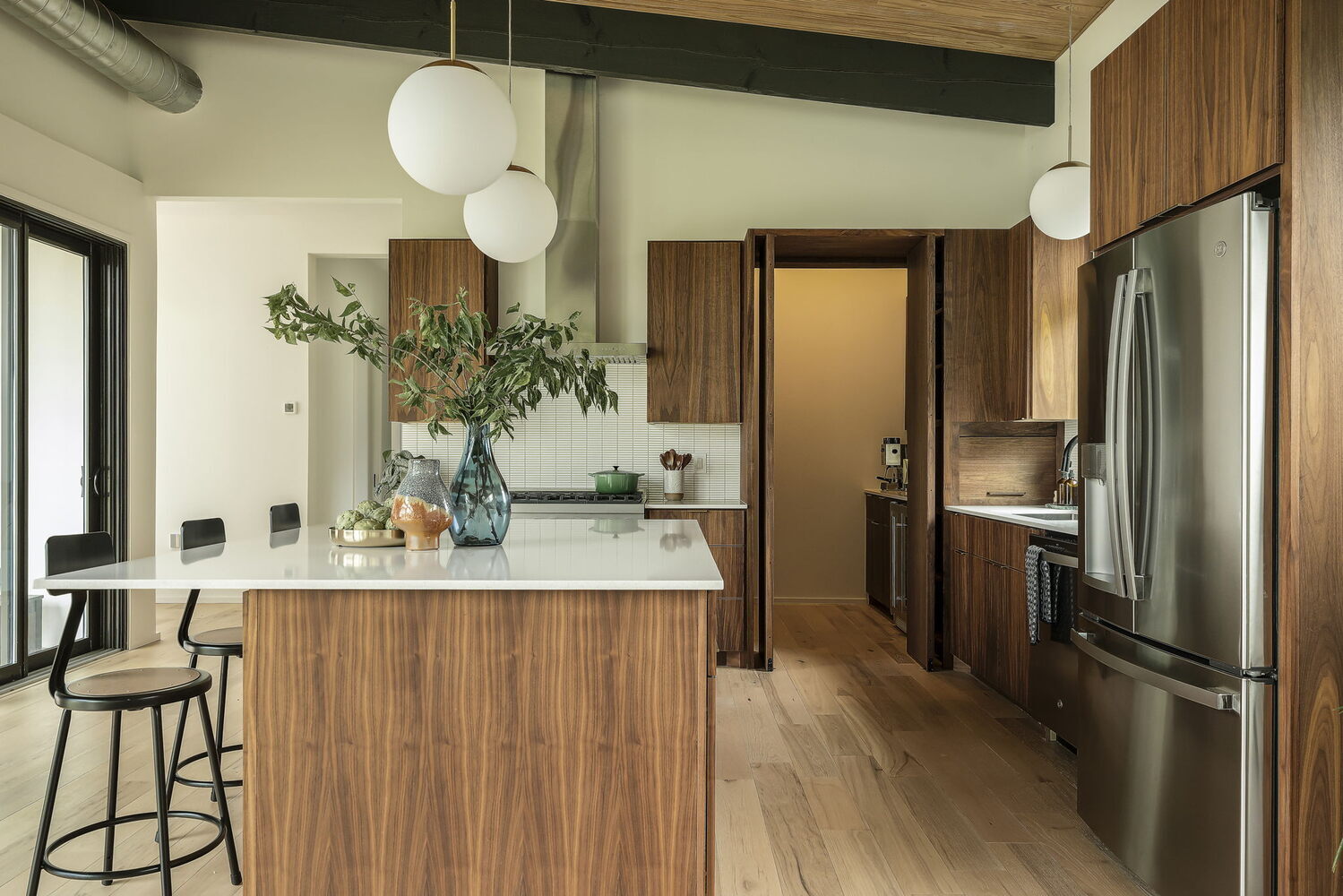 custom kitchen with integrated pantry and island design by RedOven Builds San Juan Dr Rio Grande TX