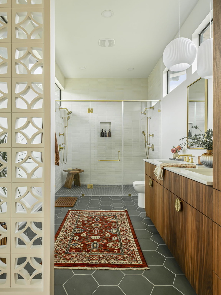 elegant new build bathroom with hex tile flooring and glass shower enclosure by RedOven Builds in Rio Grande TX