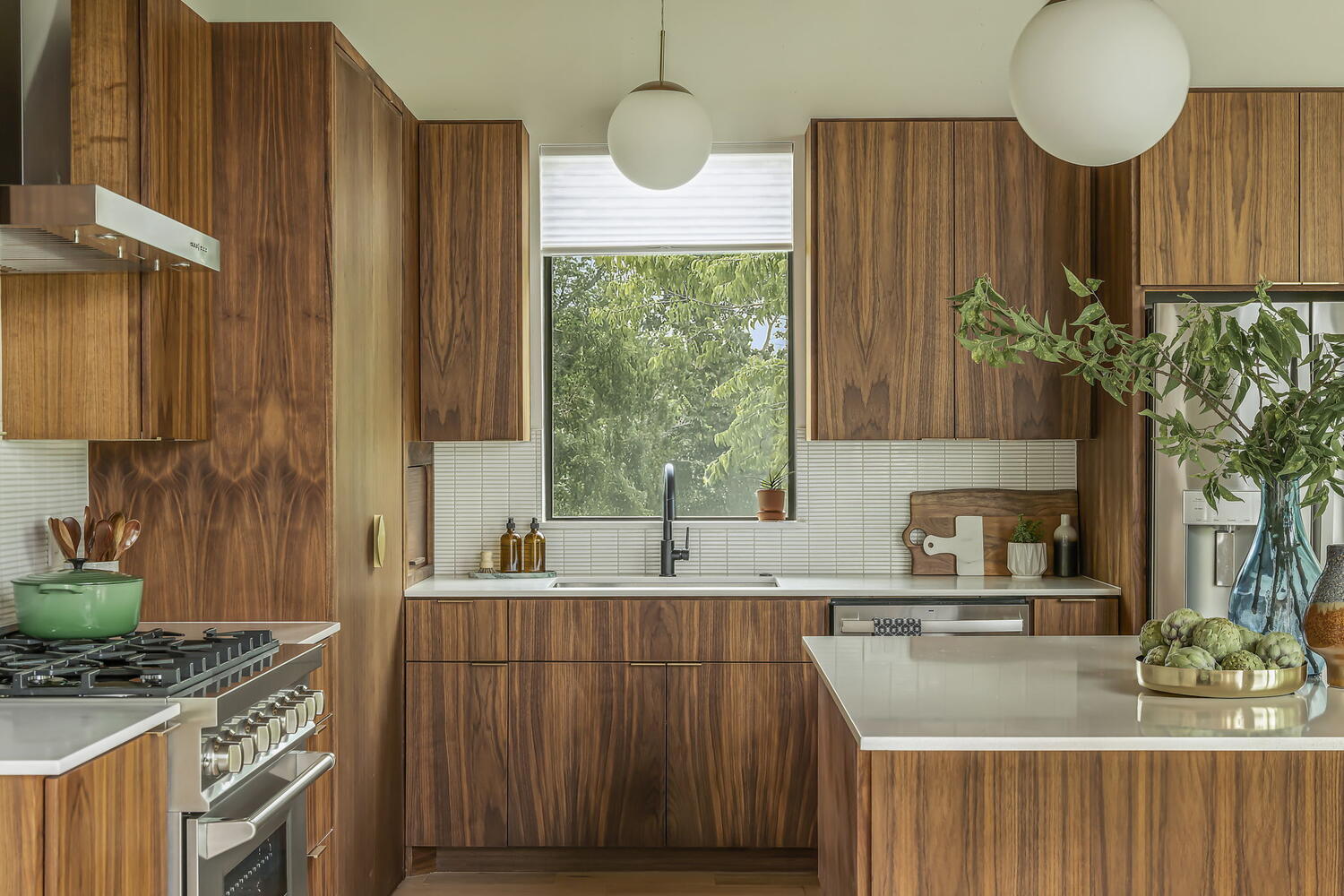 full kitchen view with stove and island in RedOven Builds custom new build San Juan Dr Rio Grande TX