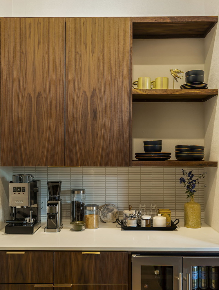 kitchen coffee station with wood cabinets, open shelving, and countertop decor by RedOven Builds in Rio Grande TX