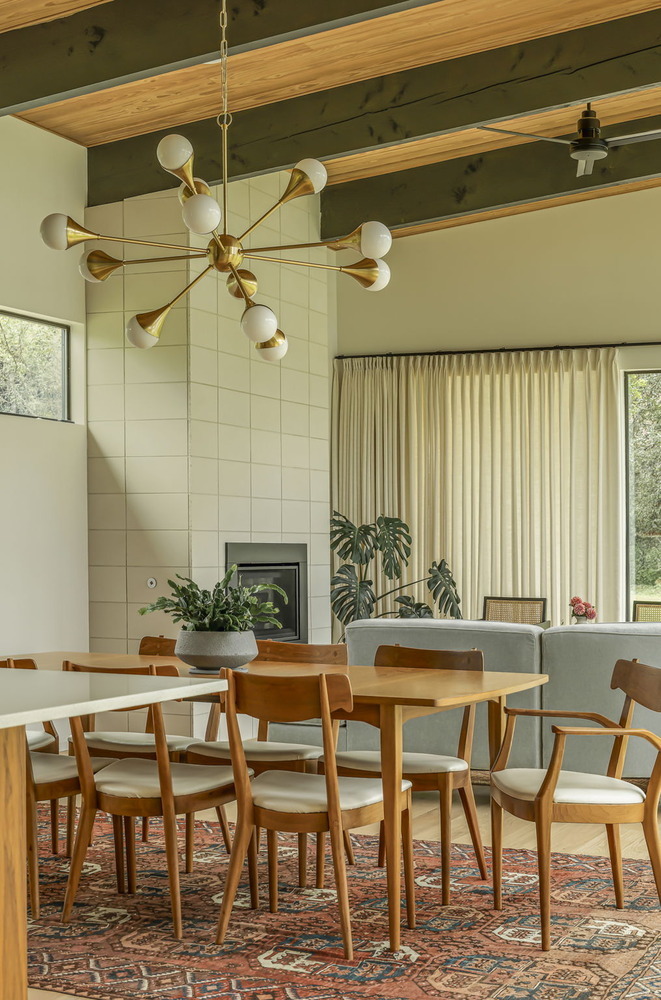 modern kitchen with wood cabinetry and island seating by RedOven Builds San Juan Dr Rio Grande TX